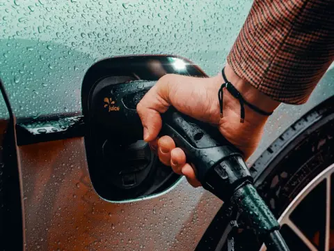hand close up charging car