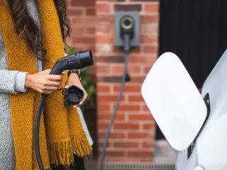 person plugging in car