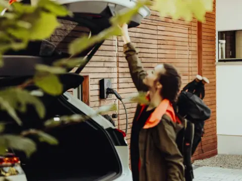 woman closing boot on ev