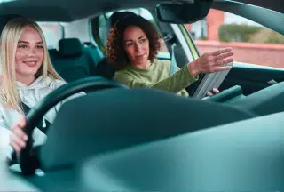 two-women-driving-car