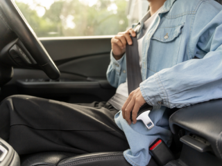 person-doing-up-seatbelt